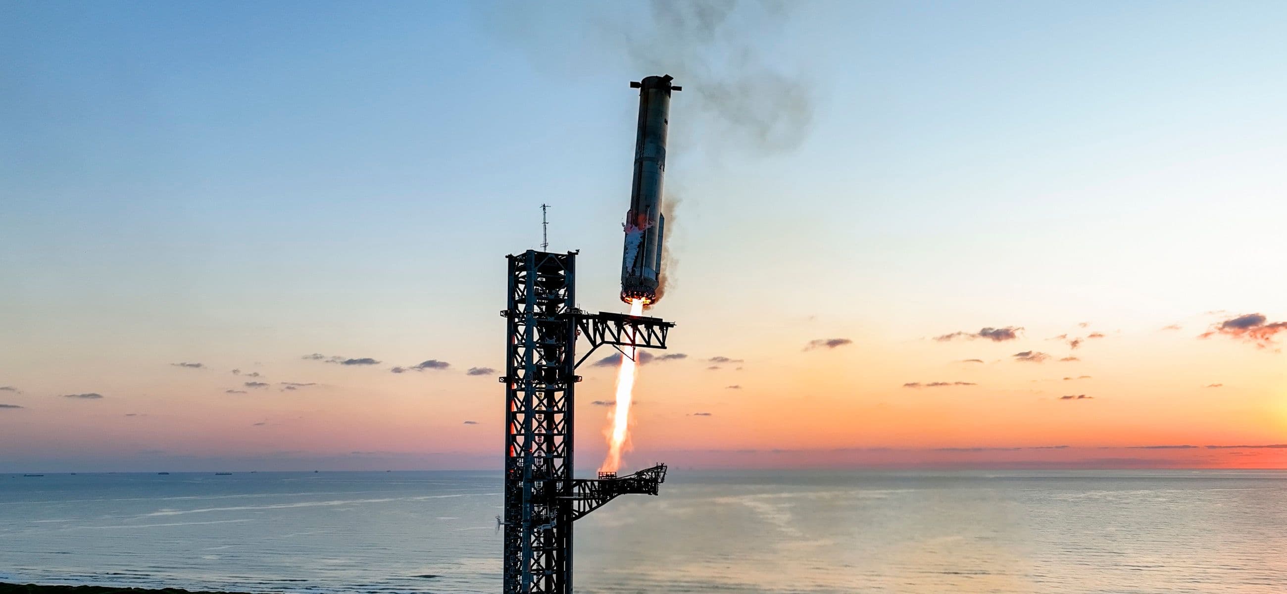 Starship and Super Heavy lifting off during a SpaceX flight test.